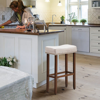 Set of 2 Upholstered 29 Inch Saddle Bar Stools with Nailhead Trim and Solid Wood Legs – Beige